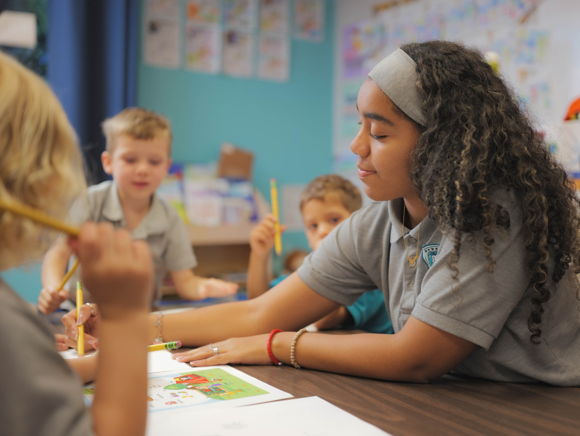 Certified VPK teacher leading a small group activity