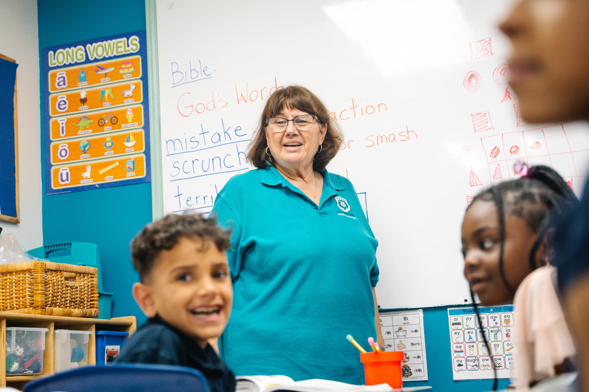 Teacher leading a phonics and Bible lesson with her class