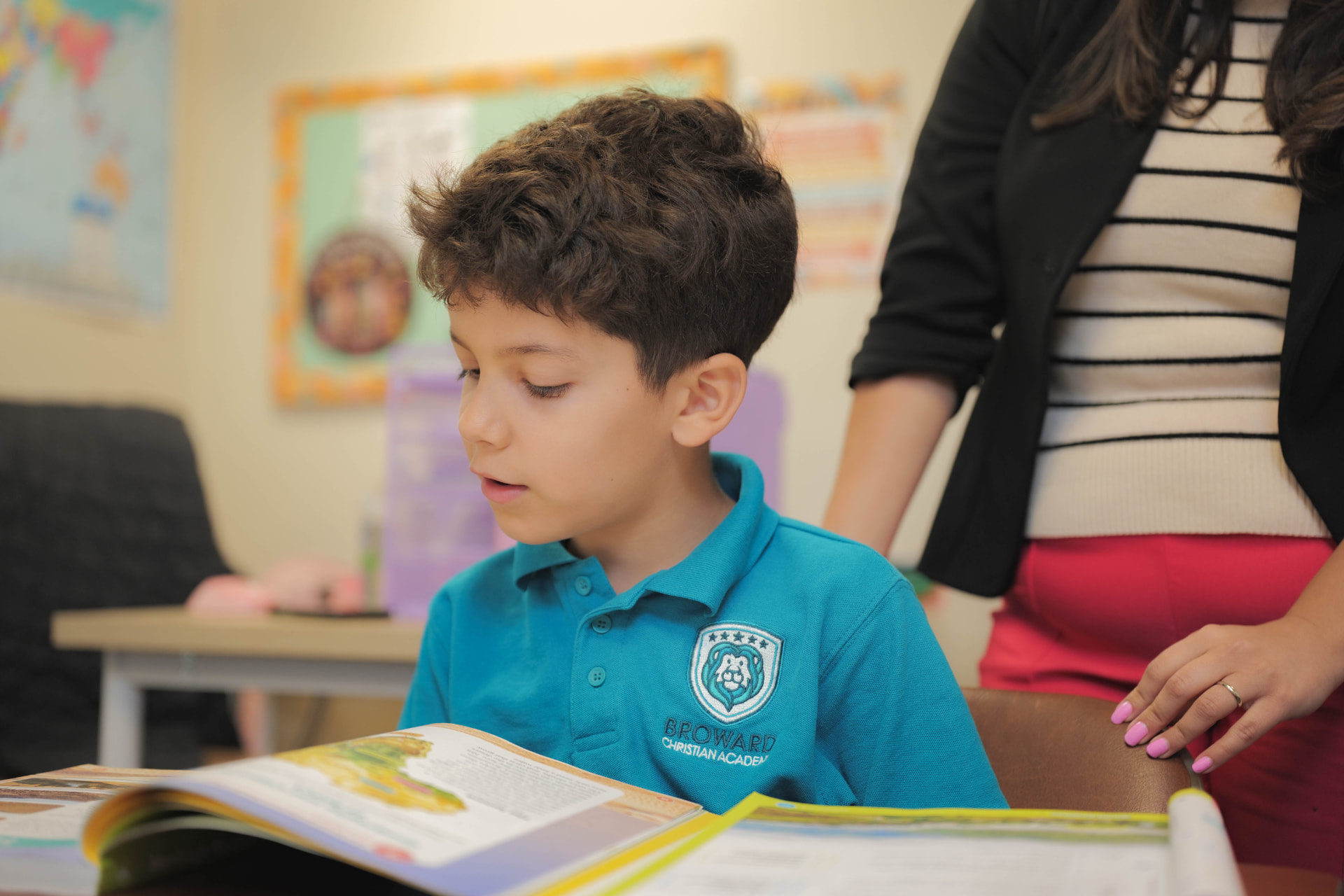 Elementary student engaged in reading and literacy curriculum